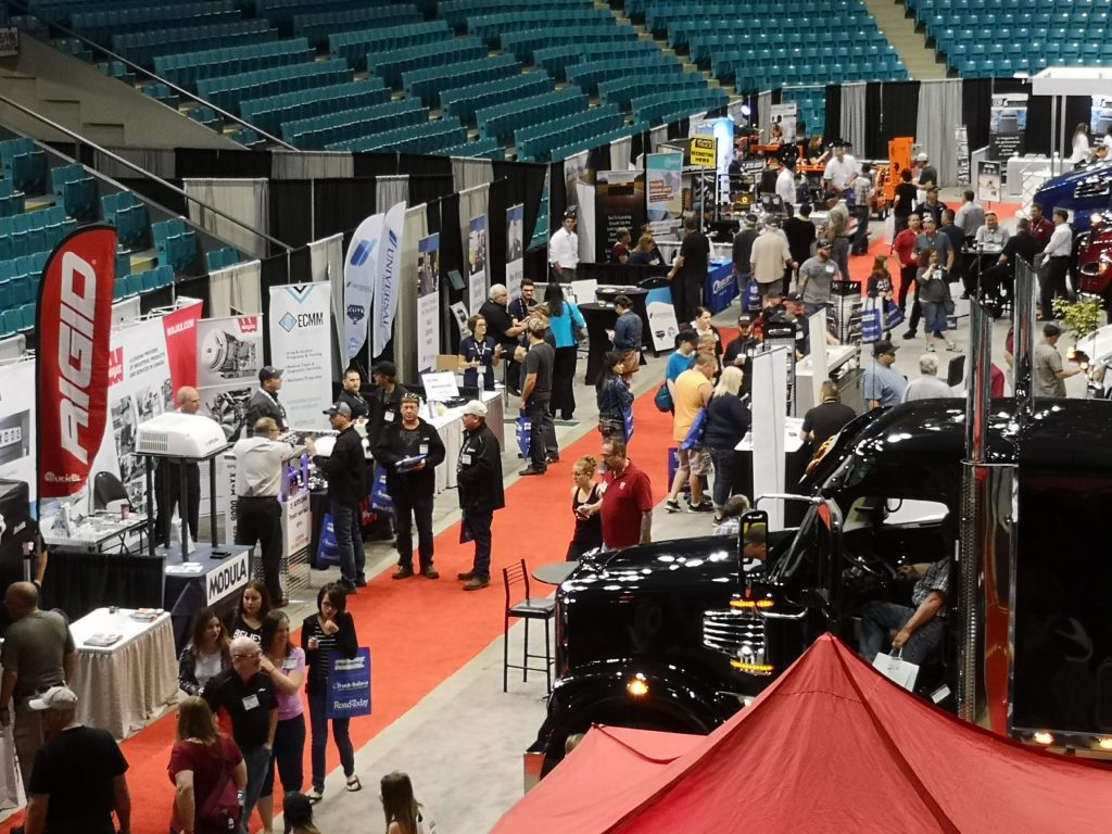 A busy trucking trade show at a hockey arena